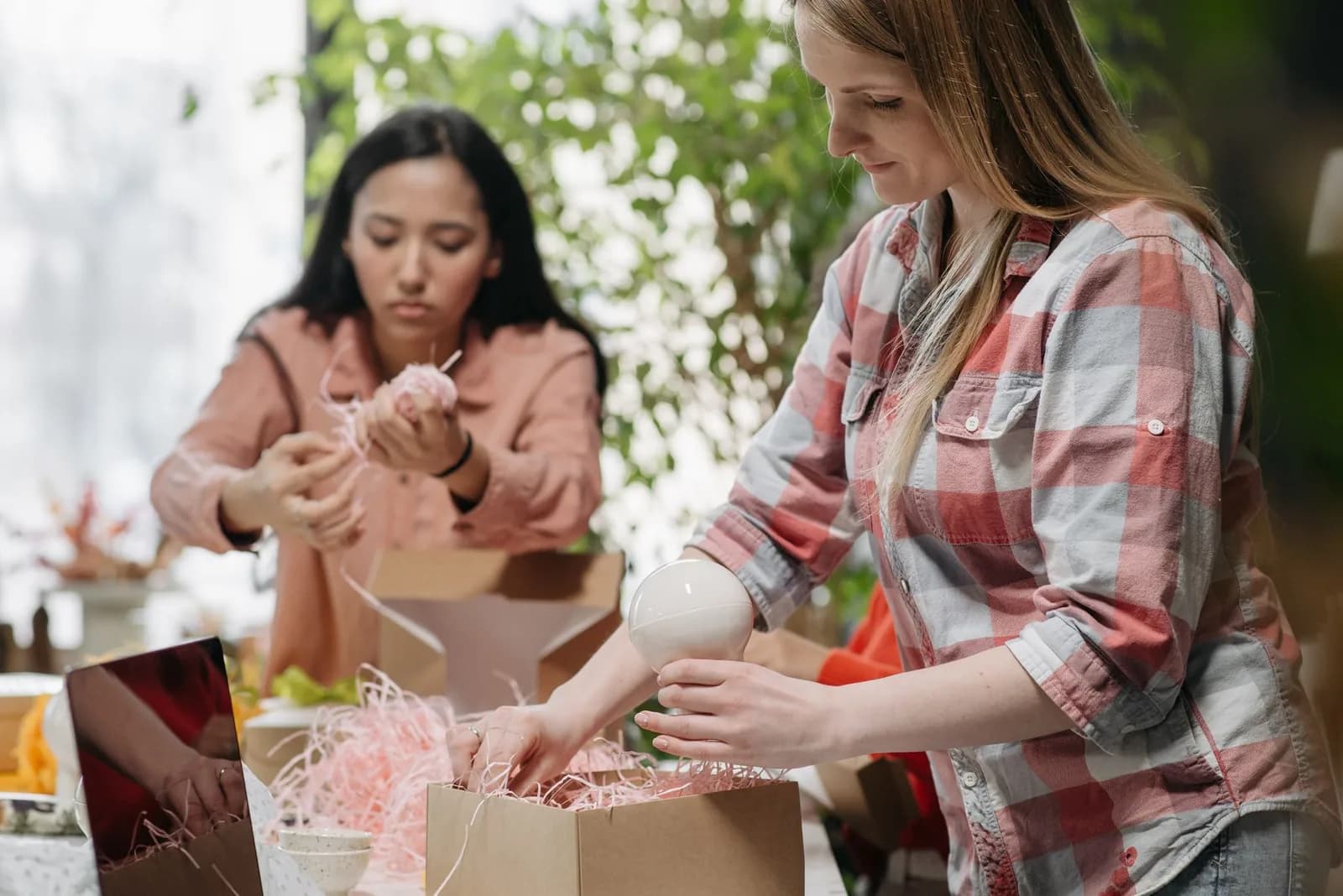 People packing products into boxes, illustrating controlled private-label fulfillment