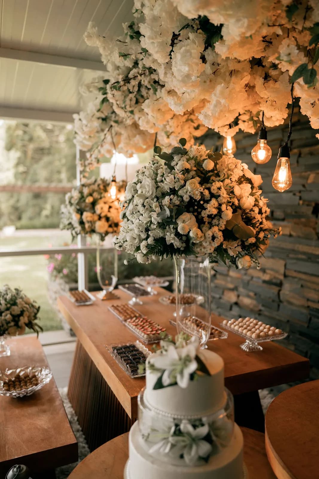 Elegant wedding reception with floral decor and warm lighting